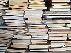 Educational books piled on table