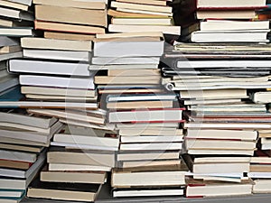 Educational books piled on table photo