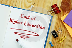 Educational concept about Cost Of Higher Education with sign on the sheet
