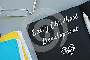 Educational concept meaning Early Childhood Development with sign on the sheet photo