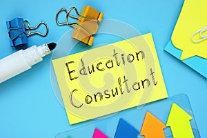 Educational concept meaning Education Consultant with inscription on the piece of paper