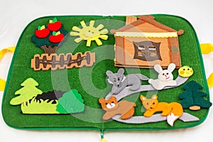 Educational felt book with wooly fairy tale toys for little children. Leisure and early development