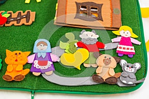 Educational felt book with wooly fairy tale toys for little children. Leisure and early development