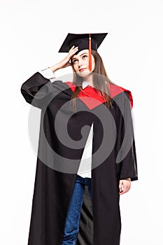 Graduating student girl in an academic gown isolated over white background