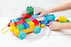 Educational toys. The child plays with the Lego designer