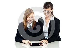 Educator and student exploring a tablet device