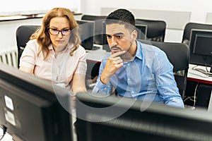 Educator and students in programming school