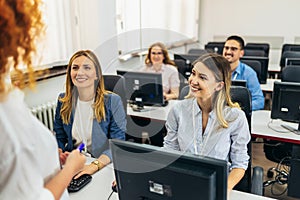 Educator and students in programming school
