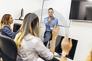 Educator and students in programming school