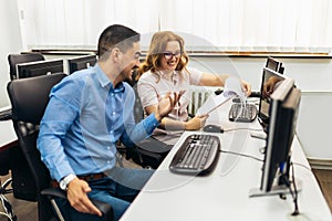 Educator and students in programming school