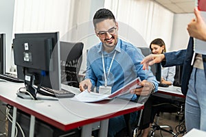 Educator and students in programming school