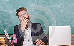 Educators more stressed at work than average people. High level fatigue. Educator bearded man yawning face tired at work