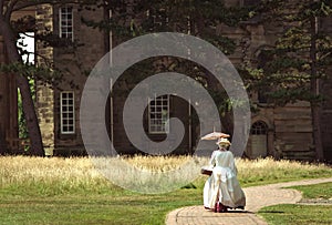 Edwardian Lady In Front Of Stately Home