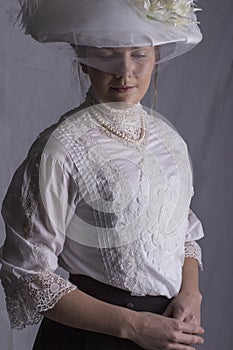 Edwardian woman in white blouse and black skirt