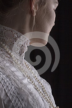 Edwardian woman in white blouse close up photo