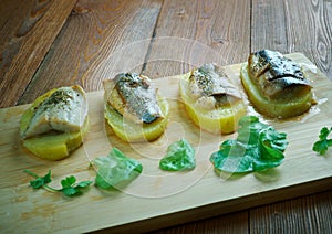 Eel with baked potatoes photo