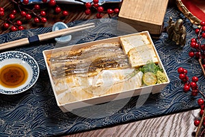 Eel fish star eel bowl in a dish with chopsticks isolated on mat side view of taiwan food