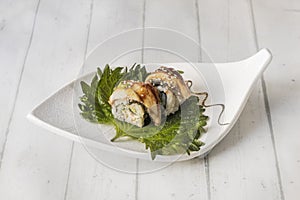 Eel wrapped uramaki roll, which is complemented with cream cheese