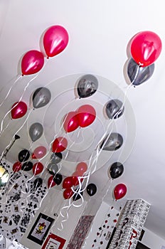 Eer-Sheva Negev, Israel - Red and black inflatable balls under the white ceiling