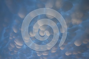 Eerie mammatus clouds fill the sky after a passing storm. photo