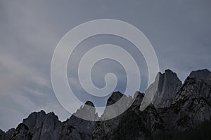 Eerie scenery of rocky mountains (arete) on a clear sky