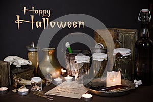 Eerie witches` kitchen with ingredients for love potion for Halloween photo