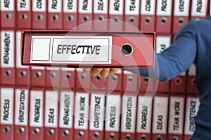 Effective concept. Young man holding ring binder.