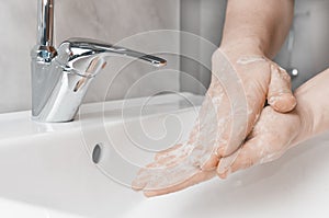 Effective handwashing tecniques: palm to palm. Hand washing is very important to avoid the risk of contagion from coronavirus and