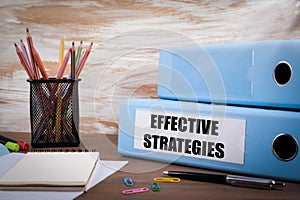 Effective Strategies, Office Binder on Wooden Desk. On the table