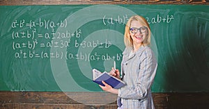 Effective teaching involve acquiring relevant knowledge. Woman teaching near chalkboard in classroom. Qualities that