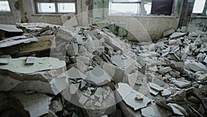 Effects of a strong earthquake indoors. Walls and communications were destroyed.