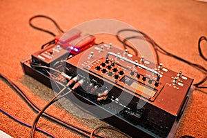Effects unit with pedals and compressors for guitar legs