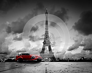 Effel Tower, Paris, France and retro red car.