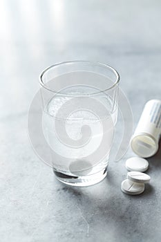 Effervescent tablet in a glass o water