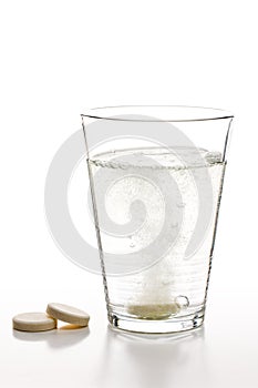 Effervescent tablets and glass with water