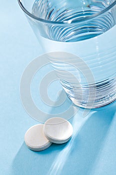 Effervescent tablets and glass with water