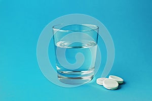 Effervescent vitamin C tablet and glass of water