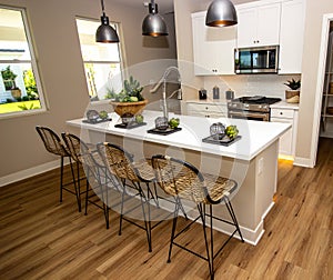 Efficient Kitchen With Island And Bar Stools