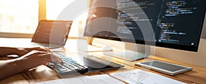 The efficient workspace with a programmer coding on a computer screen. AI generated image