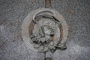 effigy with Madonna with halo in abandoned cemetery