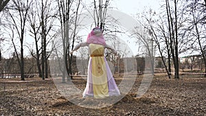 A effigy of Maslenitsa is in the park during the religious holiday of Butter Lady. A stuffed scarecrow of Crepe Week in