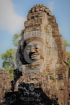 Effigy over a temple in the jungle of Cambodia