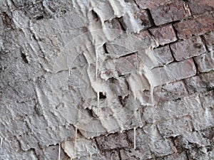 Efflorescence covering and dripping from bricks. photo