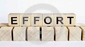 EFFORT word from wooden blocks on the desk, search engine optimization concept