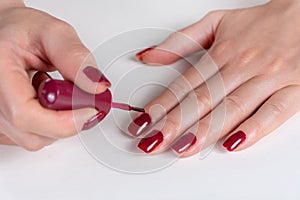 Effortless Elegance: Artful Nails Painted in Dark Red Polish