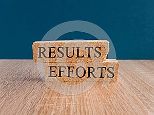 Efforts and results symbol. Concept words Efforts and results on brick blocks.