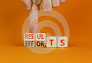Efforts and results symbol. Concept words Efforts and results on wooden cubes. Businessman hand. Beautiful orange table orange