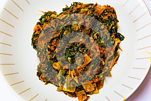 Macrophotography, close up of Efo riro shared in a dish