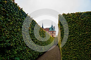 Egeskov, Denmark, Europe: Egeskov castle slot landmark fairy tale castle in Funen Denmark view from the garden