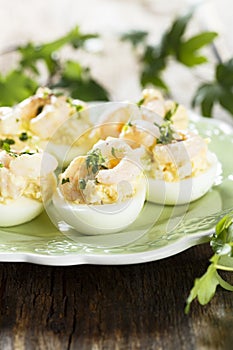 Egg appetizer with herbs and shrimps